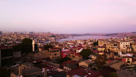 Golden-hour-aerial-dolly-over-Istanbul-city-in-Turkey,-skyline-view