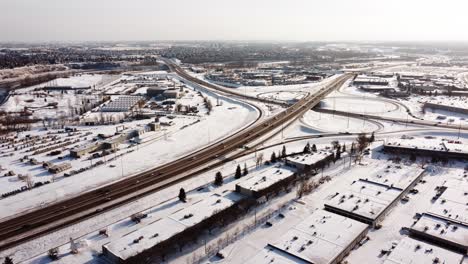 A-static-aerial-shot-of-a-snow-covered-highway-junction-on-a-sunny-winter-day-in-Calgary