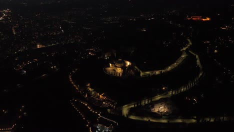 Aerial-Rotating-Clockwise-Drone-View-of-Santuario-Madonna-di-Lourdes---Verona-at-Night