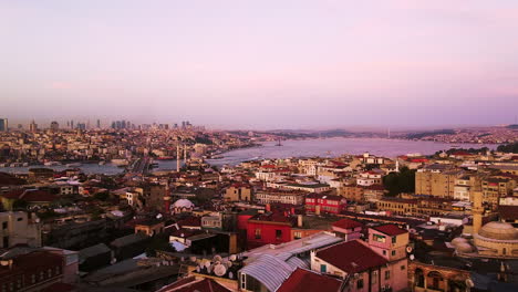 Panoramic-aerial-dolly-at-sunset-over-Instanbul-skyline,-Turkey
