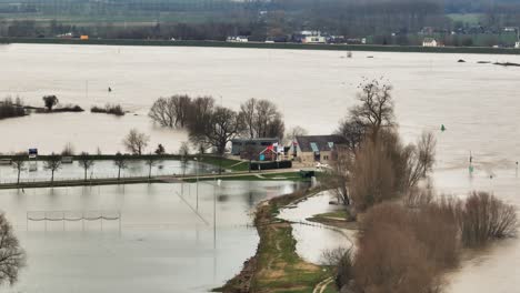 Severe-rainfall-cause-large-scale-flooding-in-Gelderland-countryside,-aerial