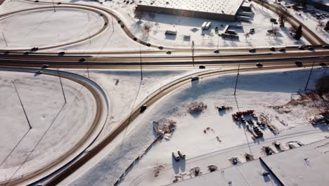 Cars-taking-the-exit-from-Deerfoot-Highway-to-Glenmore-Trail-West-on-a-sunny-winter-day-in-Calgary