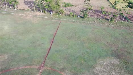 Drone-flight-over-football-fields-in-rural-Blora,-Central-Java,-Indonesia