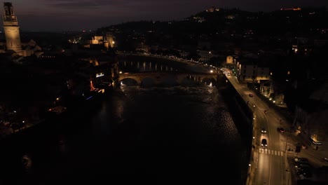 Aerial-Drone-Shot-toward-Pietra's-Bridge-in-Verona-at-Night