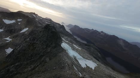 Flying-among-the-mountain-peaks-of-northern-Norway-during-midnight-sun
