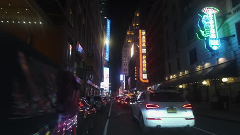 POV-shot-driving-between-traffic-on-the-streets-of-New-York,-night-in-USA