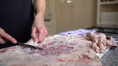 Chef-Removing-Layer-Of-Fat-From-Beef-Meat