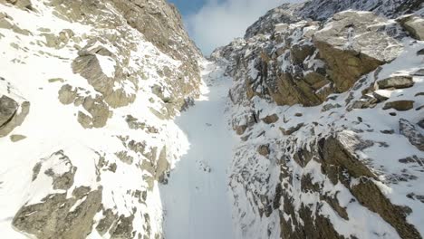 Ascending-up-a-snowy-couloir-in-northern-Norway