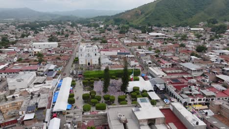 Aerial-drone-orbit-shot-of-Temple-in-Tecalitlan-City-during-Mariachi-Festival-2023
