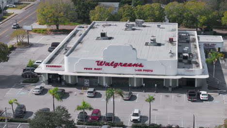 Aerial-drone-clip-looking-down-at-a-Walgreens-pharmacy-market