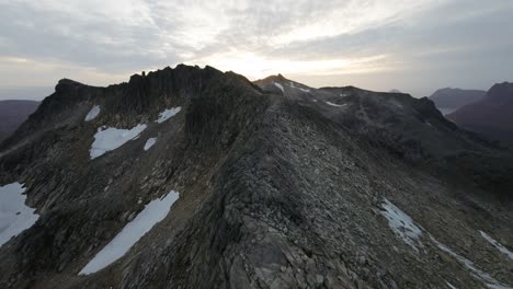 Soaring-along-a-mountain-ridge-during-sunset-in-northern-Norway