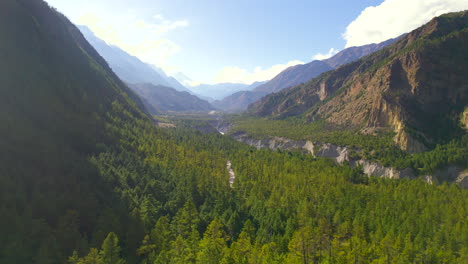 Drone-shot-of-green-vegetation-landscape-at-Manang-Nepal-Annapurna-region-Touristic-place,-Hills-and-clean-environment-cinematic-view,-palm-trees,-road-Mountains-4K