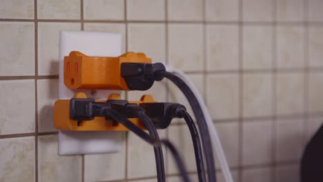 An-overloaded-outlet-is-fitted-with-plug-splitters