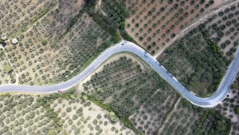 A-static,-bird's-eye-view-of-a-highway-cutting-through-a-patchwork-of-fields-in-Les-Beaux-de-Provence,-France