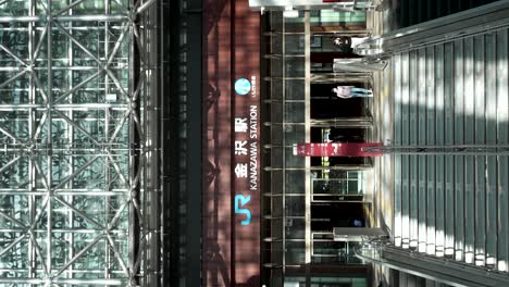 Stairway-entrance,-Japanese-contemporary-design-railway-station-VERTICAL-SHOT