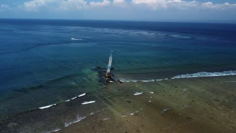 Crane-dismantling-remains-of-shipwreck-off-the-coast-of-Nusa-Lembongan-Island