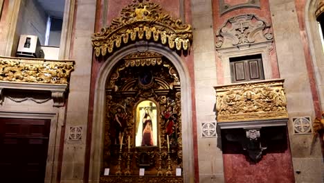 Ornate-church-altar-with-religious-icons,-sculptures-and-paintings-in-a-baroque-style-architecture