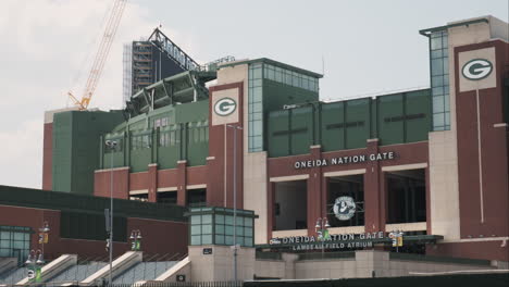 Wide-shot-of-Lambeau-Field's-historic-facade-with-a-construction-crane-in-the-background-for-renovations