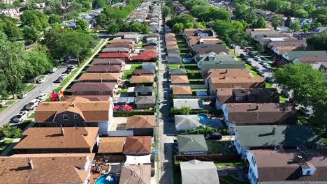 Chicago-suburb-with-rows-of-brown-roofed-houses-and-green-yards-in-summer
