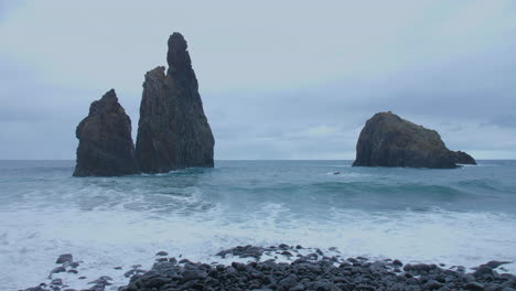 Ribeira-da-Janela-rock-Madeira-Porto-Moniz-Seixal-with-restless-wave-sea-ocean-restless-beach-on-a-cloudy-day