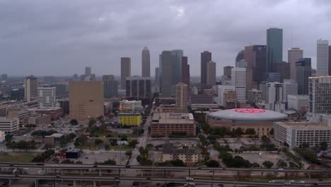 Establishing-drone-shot-of-downtown-Houston,-Texas-at-night
