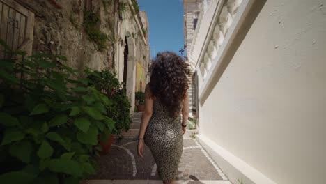 Woman-walking-exploring-city-of-Diamante-south-Italy-exploring-01