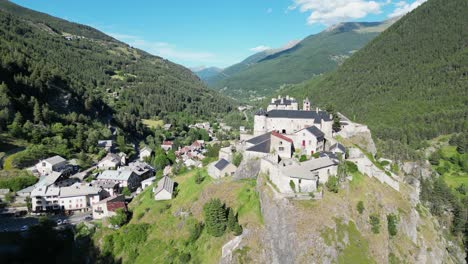 Fort-Queyras-in-Chateau-Ville-Vieille,-French-Alps,-France---Aerial-4k-Pedestal