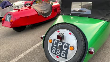 Classic-old-antique-racing-cars,-vintage-cars-at-a-parking-in-England,-expensive-exclusive-collectible-cars,-single-seat,-4K-shot