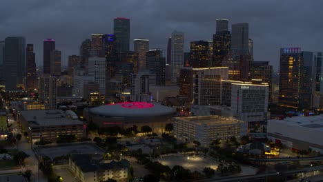Establishing-aerial-view-of-downtown-Houston,-Texas-at-night