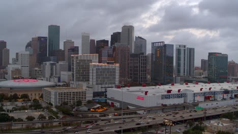 Establishing-aerial-view-of-downtown-Houston,-Texas-at-night