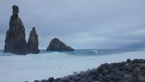 Ribeira-da-Janela-Porto-Moniz-Seixal-Madeira-rock-with-wavy-restless-sea-ocean-beach-on-a-cloudy-day