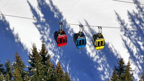Cable-cars-moving-to-the-top-of-a-mountain-in-wintertime
