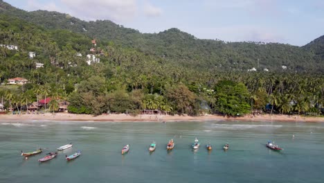 Aerial-View-Of-Sairee-Beach-Sandy-Coastline-With-Tropical-Trees-In-Background-On-Ko-Tao,-Island