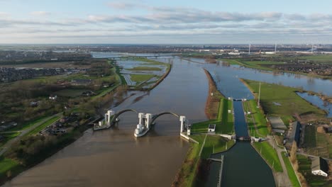 Hagestein-dam-and-lock-complex-as-flood-water-builds-up-in-Lek-river,-aerial