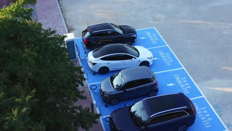 Electric-vehicles-charging-at-car-supercharger-station