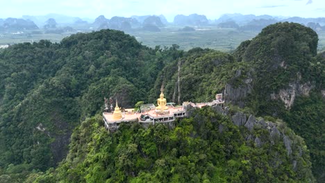 Drone-flight-backwards-from-the-Tiger-Cave-Temple,-Wat-Tham-Suea-in-Thailand