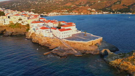 Aerial-drone-view-video-of-iconic-and-beautuful-Andros-island-chora,-Cyclades,-Greece-at-dusk