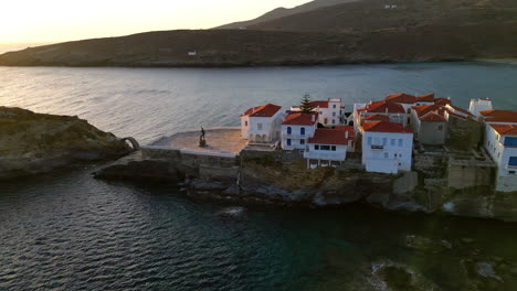 Aerial-view-video-of-iconic-Andros-island-chora,-Cyclades,-Greece-at-dusk