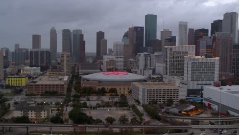 Establishing-drone-view-of-downtown-Houston,-Texas-at-night