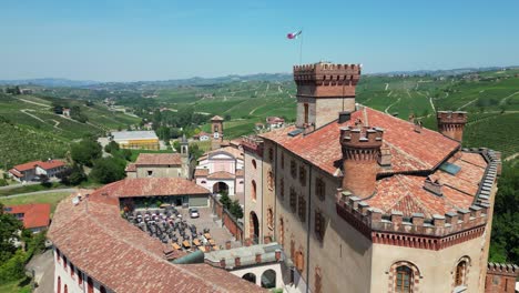 Barolo-Castle-and-Vineyards-in-Langhe-Wine-Region,-Piedmont,-Italy---Aerial-4k
