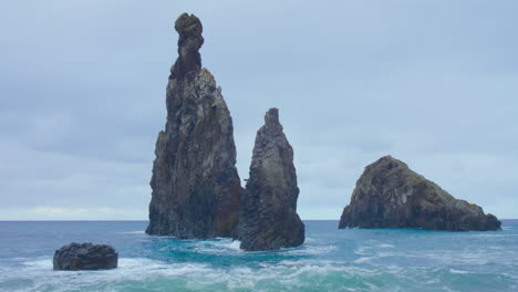 Ribeira-da-Janela-Porto-Moniz-Seixal-Madeira-rock-with-restless-wave-sea-ocean-restless-beach-on-a-cloudy-day