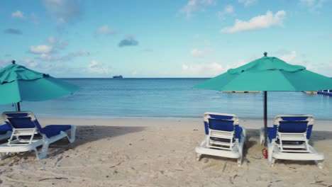 Close-up-pan-shot-of-beach-chairs-and-umbrellas