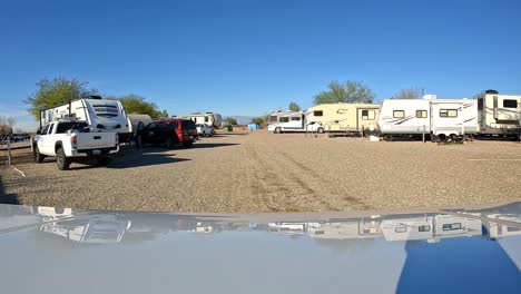 point-of-view---Driving-slowly-thru-the-campgrounds-on-a-sunny-winter-afternoon-at-the-Pima-Country-Fair-Grounds