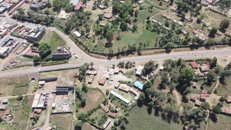 Traffic-on-road-junction-in-African-town-Loitokitok,-Kenya,-aerial-top-down