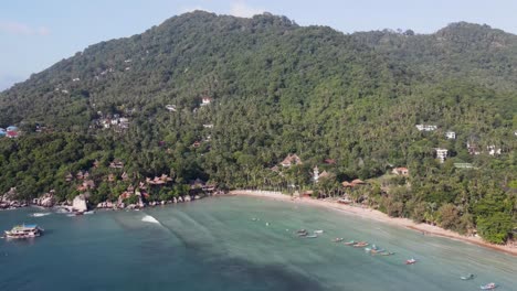 Aerial-View-Of-Sairee-Beach-With-Tropical-Forested-Hills-In-Background-In-Ko-Tao,-Thailand