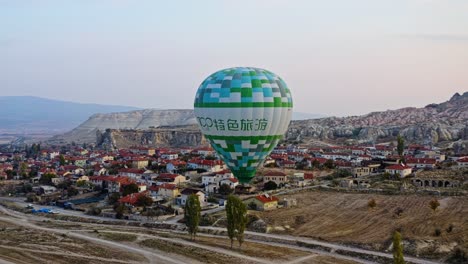 Travelers-Enjoying-Early-Morning-Ride-In-Hot-Air-Balloon-Over-Cappadocia-In-Turkey