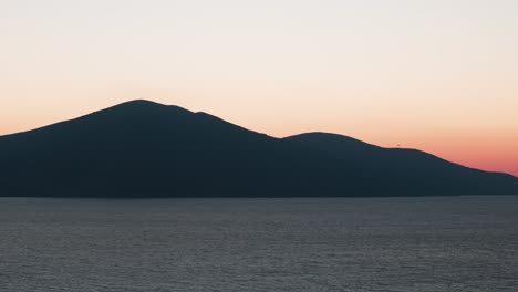Dark-mountain-silhouette-during-sunset-golden-hour-near-Adriatic-sea