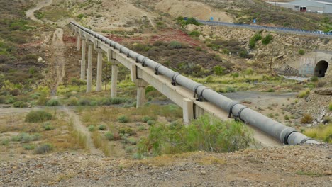 Aqueduct-for-old-pipeline-to-cross-valley-in-Tenerife-island,-tilt-up-view