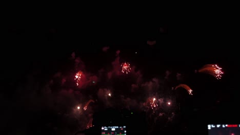 Cameras-lined-up-in-a-row-in-front-of-a-pyrotechnic-display-at-a-beachfront-during-a-fireworks-festival