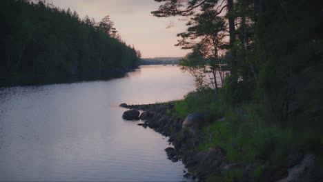 Calm-lake-in-a-Swedish-forest-on-a-summer-evening
